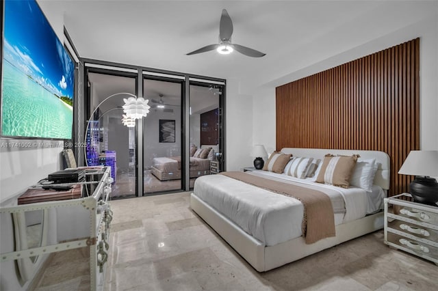 bedroom featuring a wall of windows and ceiling fan