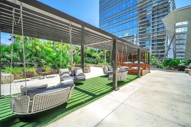 view of patio with outdoor lounge area and a pergola