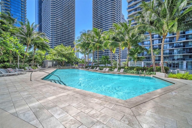 community pool featuring a patio area