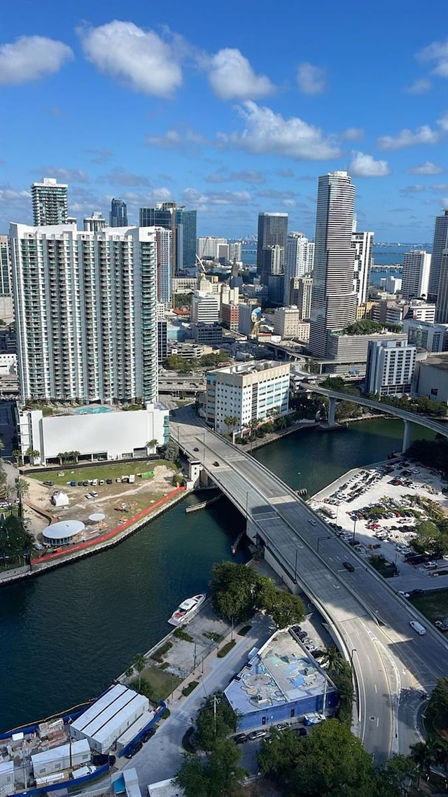 bird's eye view featuring a view of city and a water view