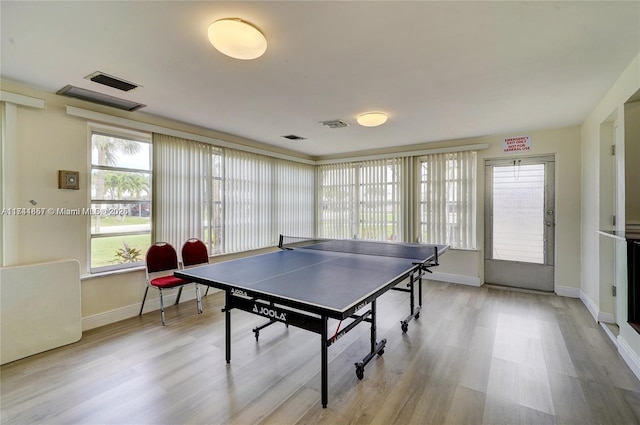 recreation room with light hardwood / wood-style floors and a wealth of natural light