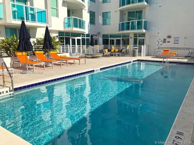 view of pool featuring a patio