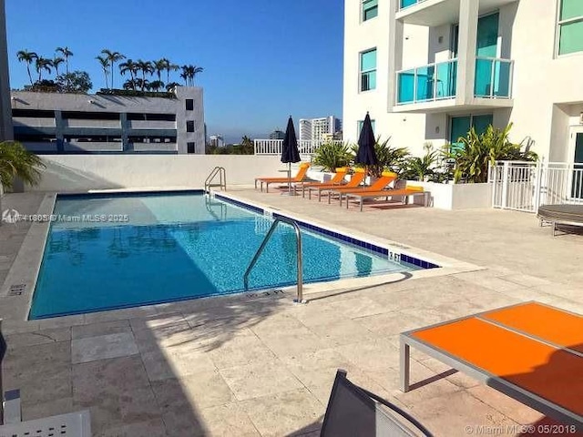 view of pool featuring a patio area