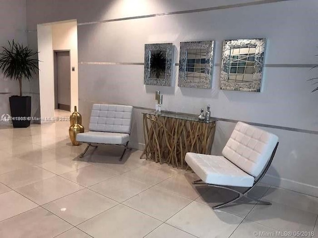 sitting room with tile patterned flooring