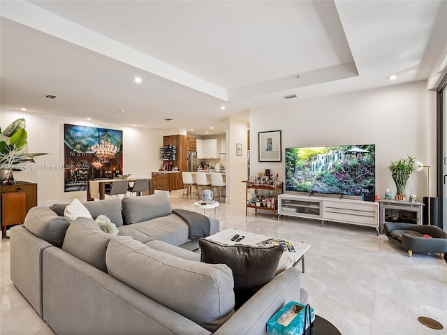 living room with a raised ceiling