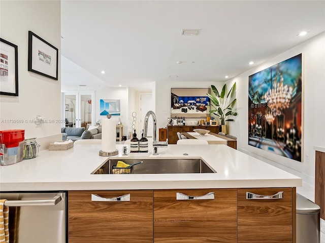 kitchen featuring sink, french doors, and dishwasher