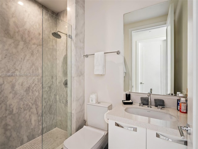 bathroom with vanity, toilet, and an enclosed shower