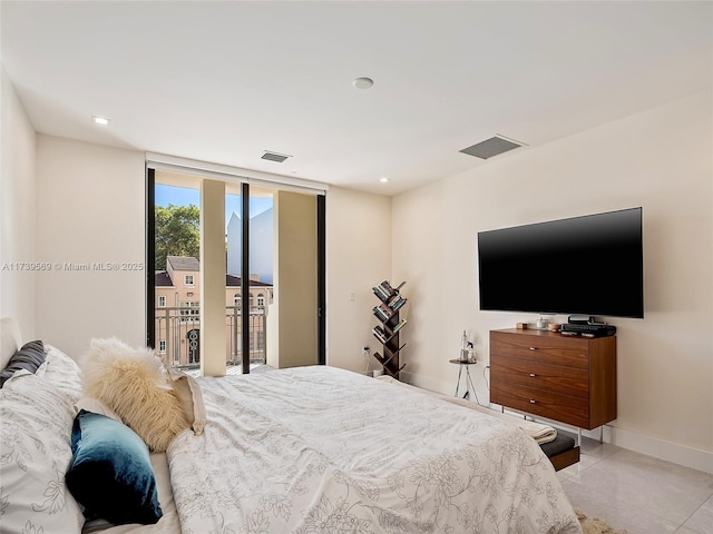 bedroom featuring light tile patterned flooring and access to exterior