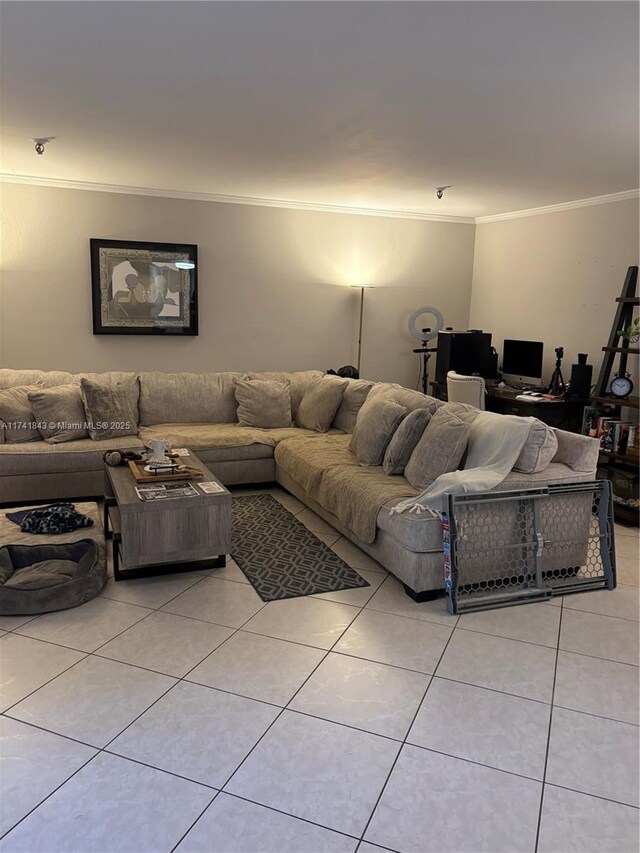 living room with crown molding and light tile patterned flooring