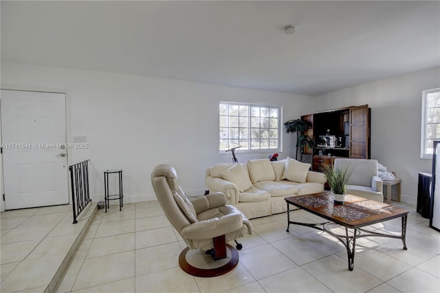 tiled living room with a healthy amount of sunlight