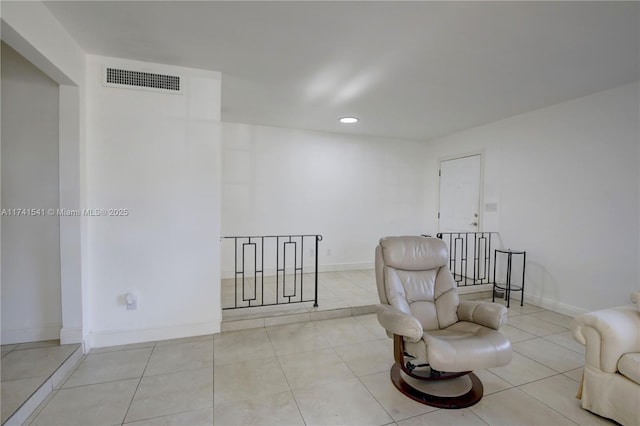 sitting room with light tile patterned flooring