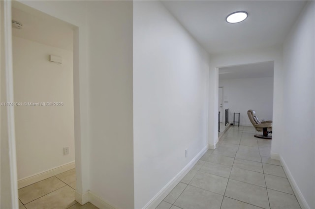 hallway featuring light tile patterned floors