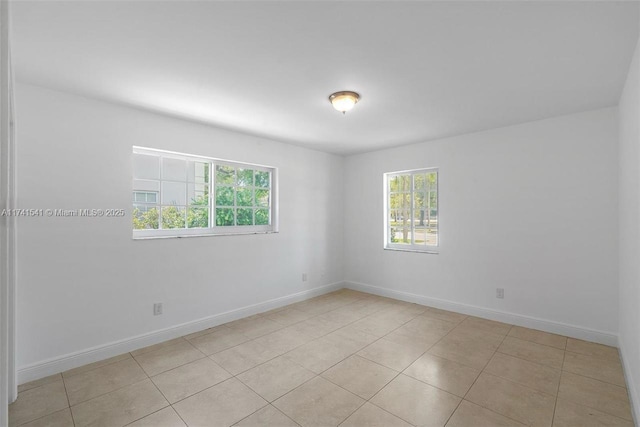 empty room featuring light tile patterned flooring