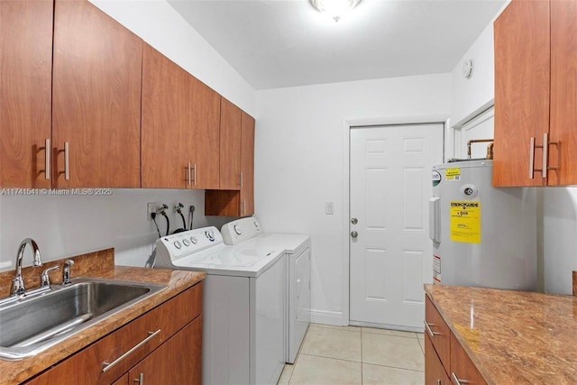 clothes washing area with cabinets, separate washer and dryer, sink, and light tile patterned floors