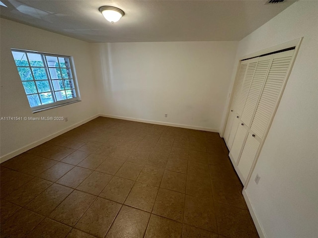 unfurnished bedroom featuring a closet