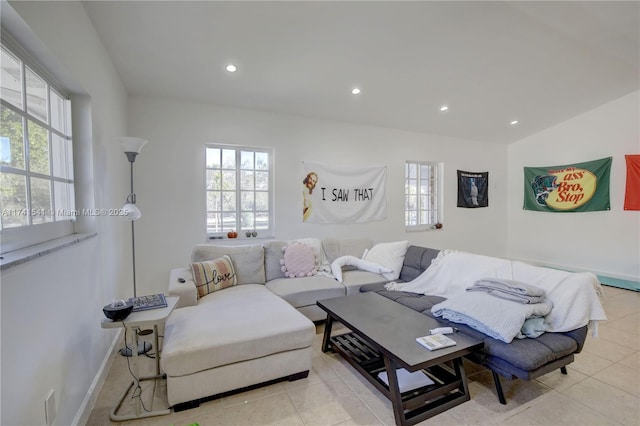 tiled living room featuring a wealth of natural light