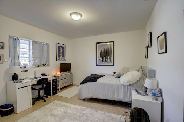 bedroom featuring light tile patterned floors