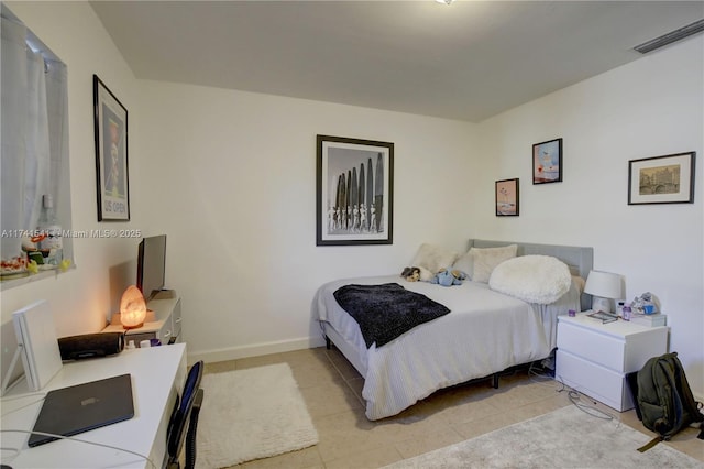 bedroom with light tile patterned flooring