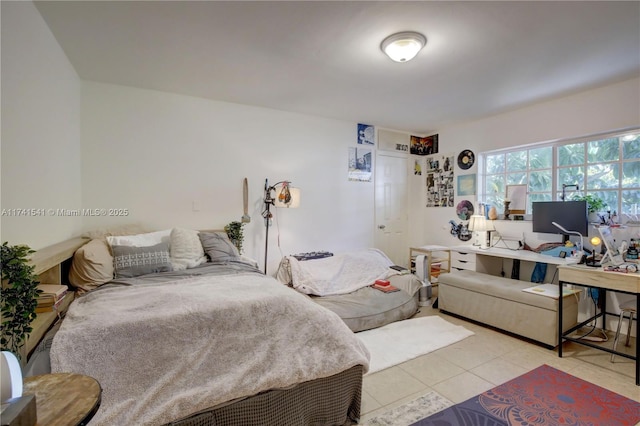 bedroom with light tile patterned flooring