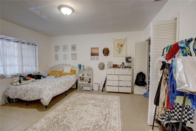 bedroom with light tile patterned flooring