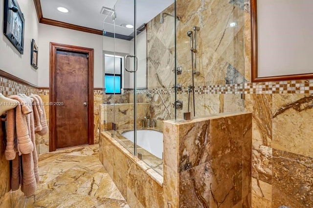 bathroom featuring crown molding, separate shower and tub, and tile walls