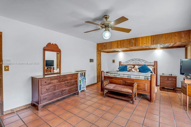 tiled bedroom with ceiling fan