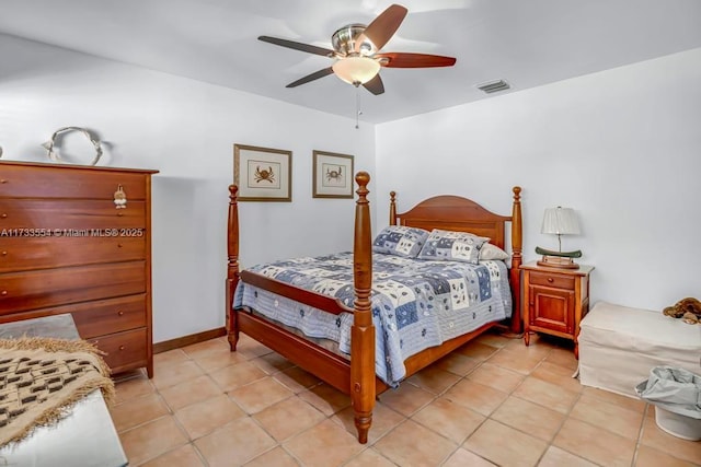 tiled bedroom featuring ceiling fan