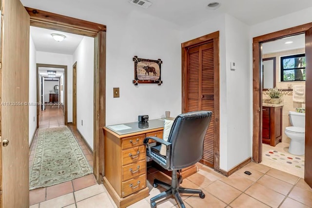 office area with light tile patterned floors