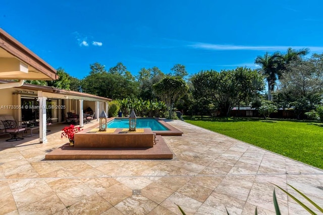 view of pool featuring a patio area and a lawn