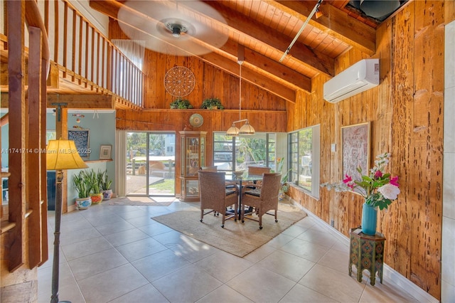 tiled dining space featuring wood walls, high vaulted ceiling, an AC wall unit, wooden ceiling, and beamed ceiling