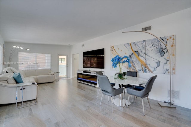 dining area with light hardwood / wood-style flooring