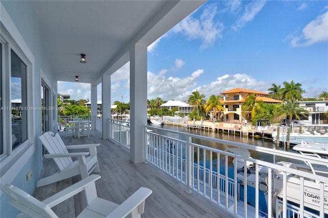 wooden terrace with a water view