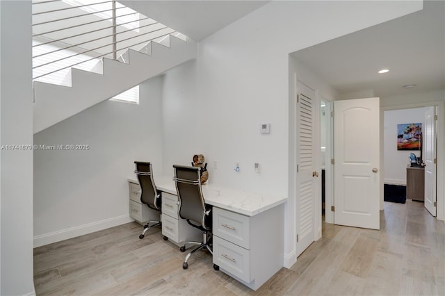 office area with light hardwood / wood-style floors