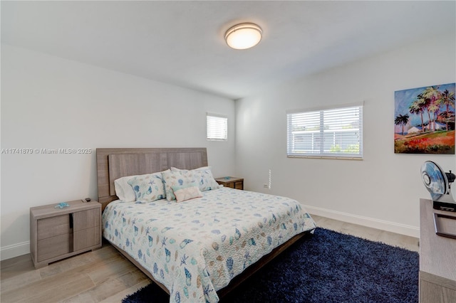 bedroom featuring multiple windows