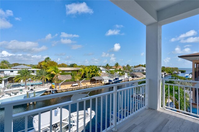 balcony featuring a water view