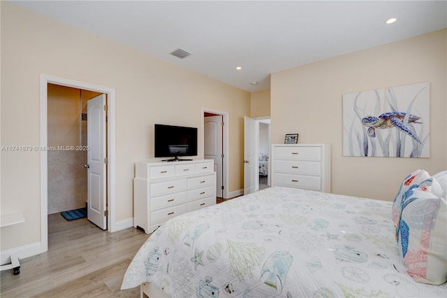 bedroom with light hardwood / wood-style flooring