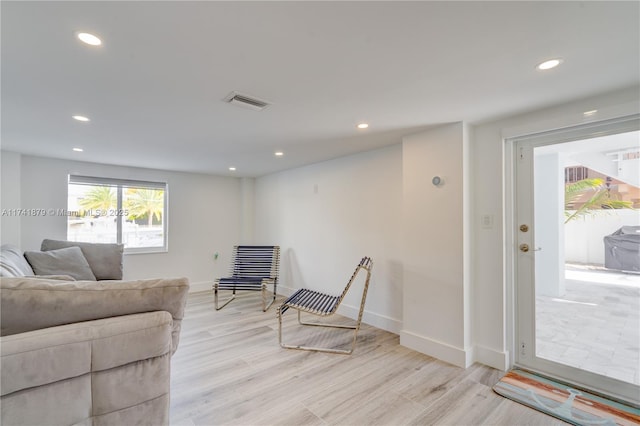 living room with light hardwood / wood-style flooring