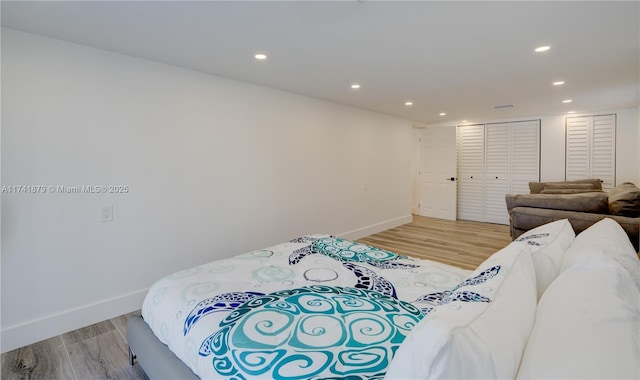 bedroom featuring light hardwood / wood-style floors and a closet