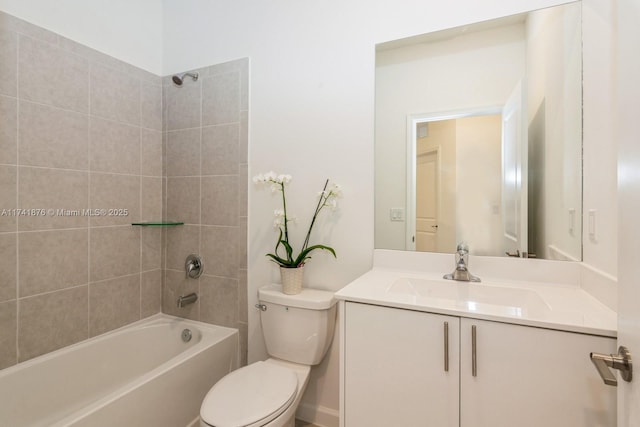 full bathroom featuring vanity, toilet, and tiled shower / bath