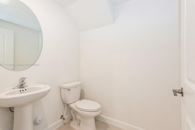 bathroom with tile patterned floors and toilet