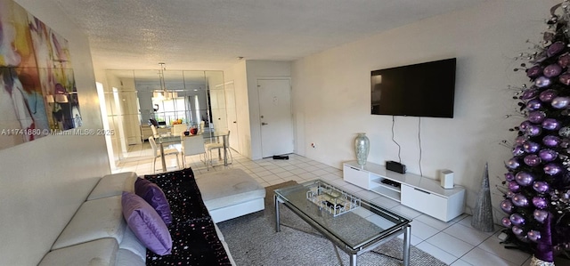 living room with light tile patterned floors and a textured ceiling