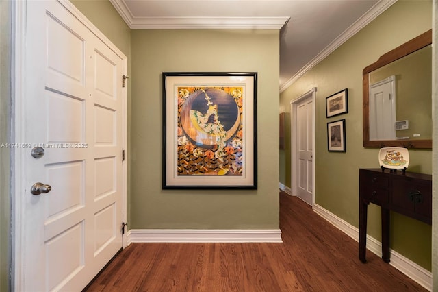 hallway with ornamental molding and dark hardwood / wood-style floors