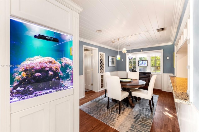 dining area featuring crown molding, dark hardwood / wood-style floors, and wooden ceiling