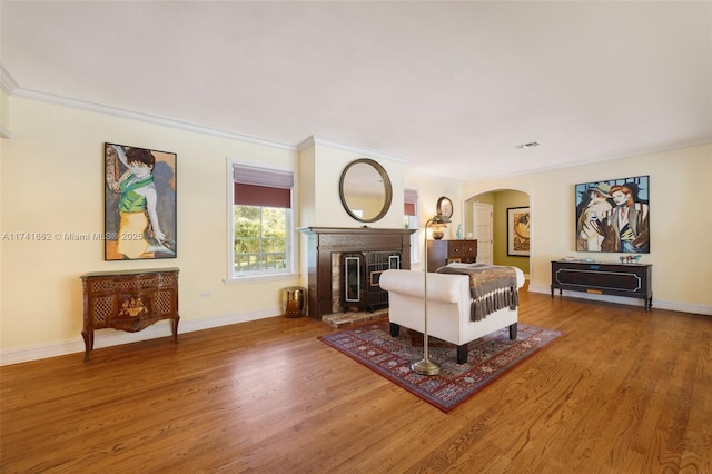 living room with hardwood / wood-style flooring and ornamental molding