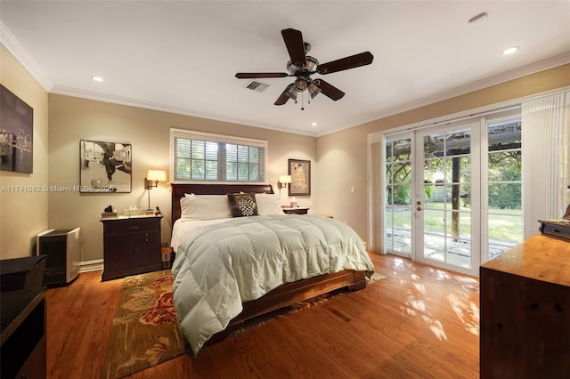 bedroom featuring multiple windows, access to exterior, crown molding, and hardwood / wood-style floors