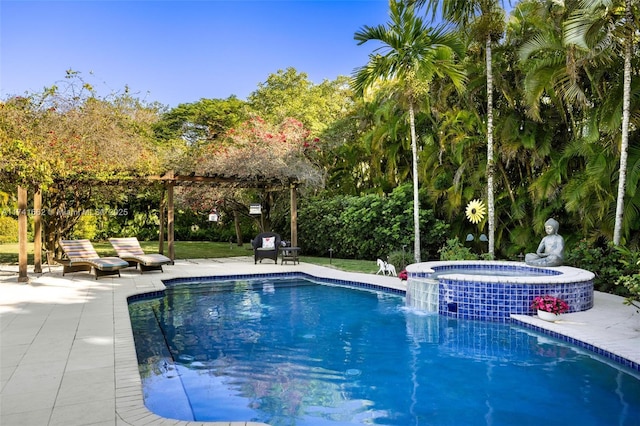 view of pool featuring a patio and an in ground hot tub