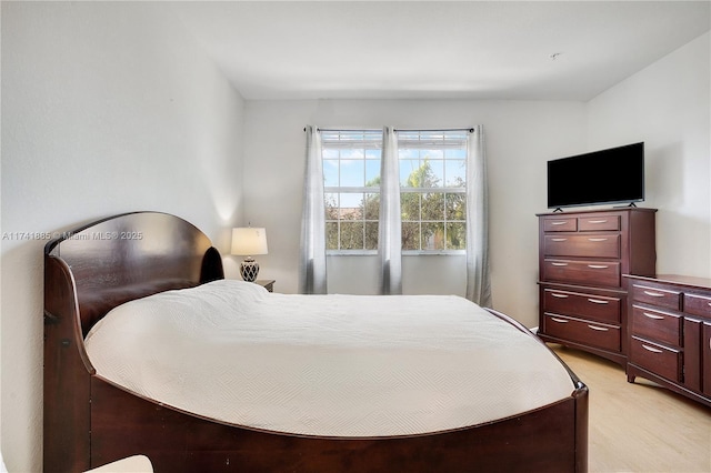 bedroom with light wood-style floors