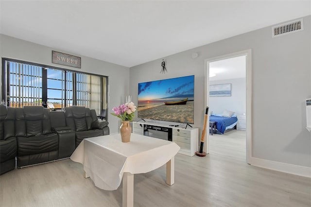 living room with light hardwood / wood-style flooring