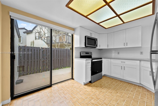 kitchen featuring appliances with stainless steel finishes and white cabinets