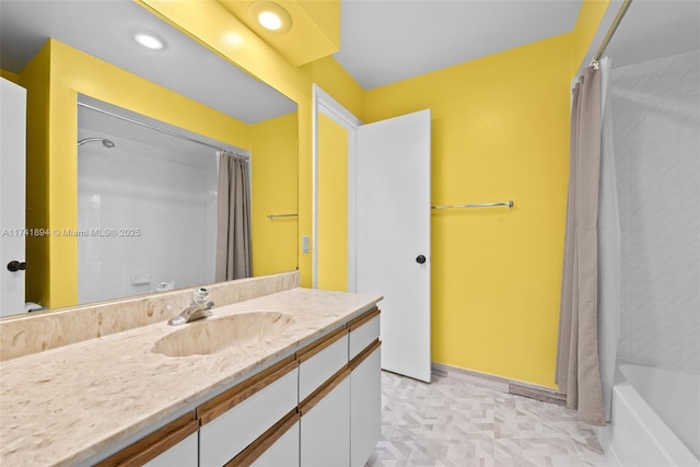 bathroom featuring shower / tub combo and vanity